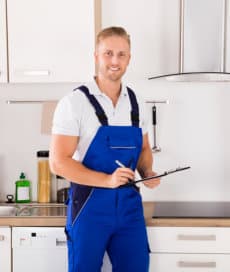 handyman fixing diagnosing appliance