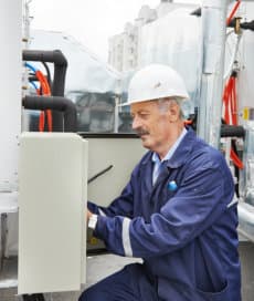 handyman fixing commercial freezer